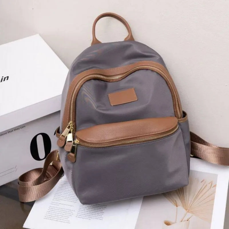 Curved-Zip Pocket Backpack