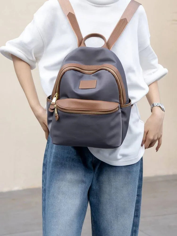 Curved-Zip Pocket Backpack